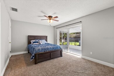 MASTER BEDROOM WITH SLIDER ACCESS TO THE SCREENED 