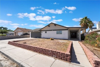 Ranch-style home with driveway and a garage