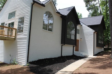 View of side of property featuring brick siding