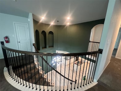 Corridor with an upstairs landing, carpet floorin
