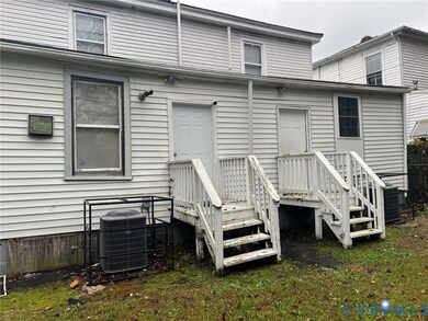 Rear view of property with a deck