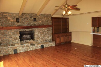 With fireplace, vaulted ceiling, built-in cabinetry and wood flooring plus easy access to the kitchen.