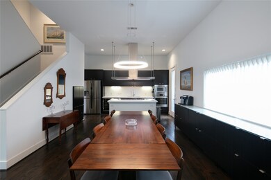 Long dinning room big enough for an 8 top flows seamlessly into the dinning room.  Perfect for entertaining.