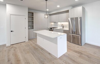 Kitchen with stainless steel appliances, a sink, 