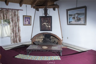 Your friends and you will enjoy the warmth of the fireplace while chatting in the Sunken Conversation Pit.