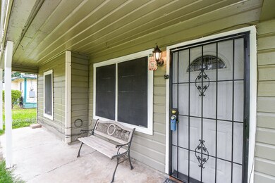 The front porch has ample sitting room to watch the world go by on a lazy afternoon.