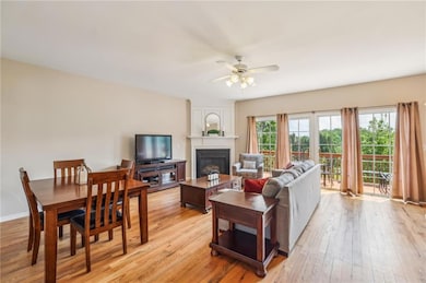 Living room with a large fireplace, new hardwood f
