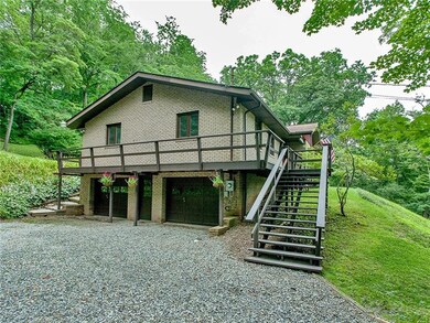 This all brick home has a two car garage and a wra