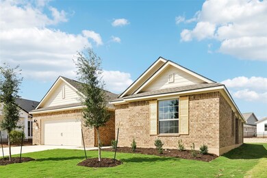Ranch-style house with brick siding, driveway, a 