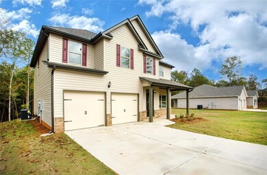 Craftsman-style home with a front lawn, a garage, 
