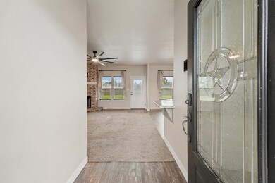 This inviting entryway leads to a spacious living