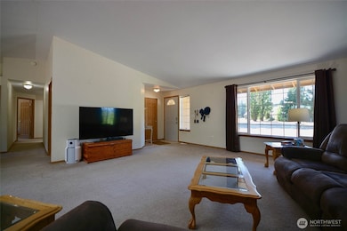 The vaulted ceilings add to the expansive feel of the livingroom and the generous windows bring the outdoors inside. It's a big enough room for all occasions.