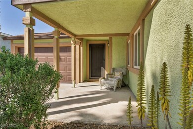 Property entrance with a garage and stucco siding