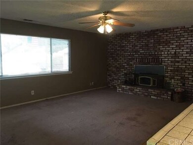 Living Room with wood stove insert off Kitchen