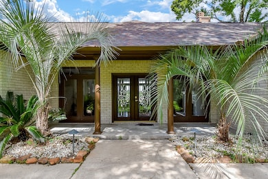 Front entryway features a well-maintained path, ma