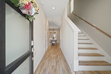 As you step inside, you’re greeted by wide plank h