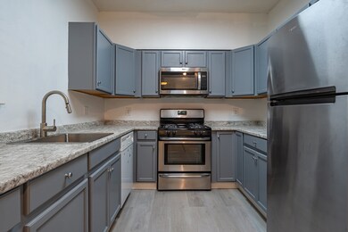 Spicket Commons unit 115, Methuen, MA 01844 - photo 5