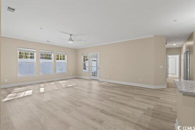 Unfurnished living room with baseboards, a ceiling fan, and light wood-style flooring