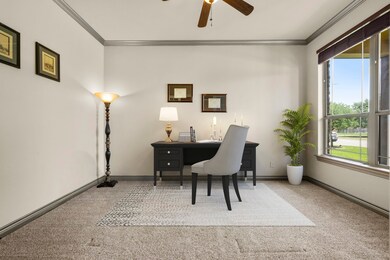 Virtually staged office/study with natural lighting.