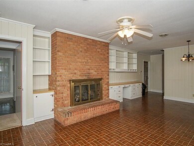 Very spacious den with gas log fireplace.