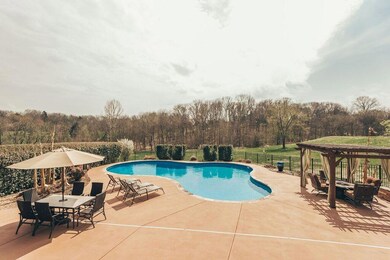 Enormous patio with pergola and plenty of room for entertaining. Gas lines power the fire pit and your grill!