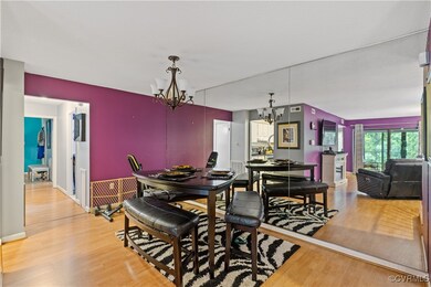 Dining room with a chandelier and hardwood / wood-
