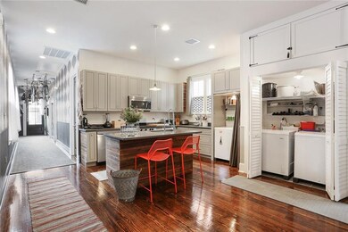 Kitchen with side hall to front porch on left.
