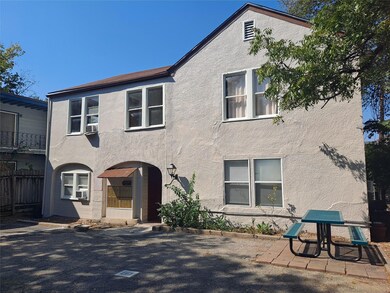 View of front of house with stucco siding and fen