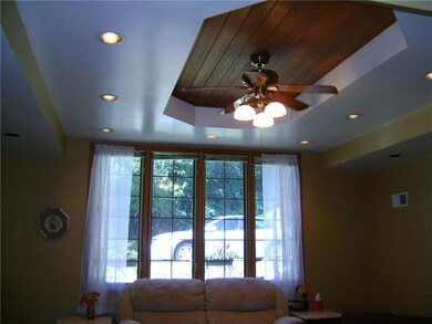 UNIQUE RECESSED CEILING IN LIVING ROOM FEATURES A 