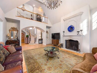 View from living room of foyer with spiral stairca