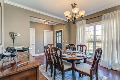 You will enjoy many fine diners in your formal dining  with hardwoods under foot.