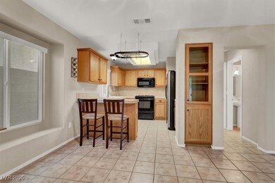 Kitchen featuring breakfast bar