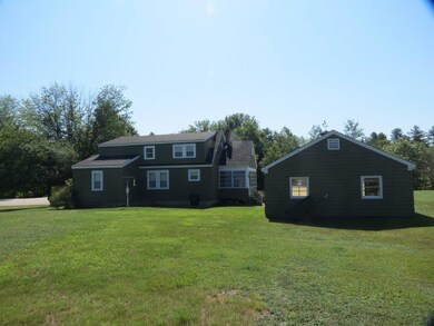 View of house & garage from backyard.