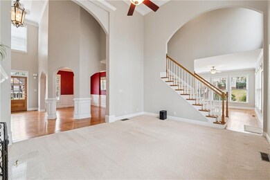 Unfurnished living room with carpet flooring, a to