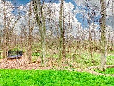 Next to the home is the start of a walking path.