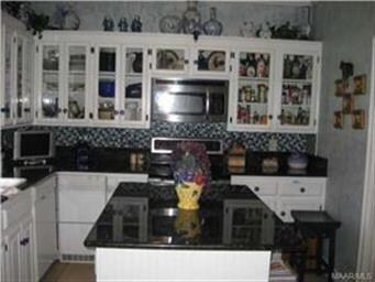 Kitchen cabinets with glass doors.