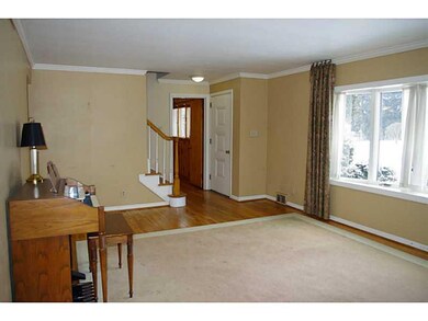 Living Room. Large picture windows and gleaming ha