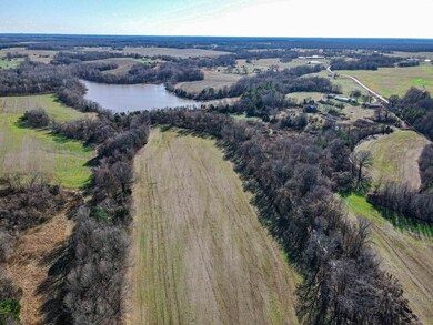 Drone / aerial view featuring a water view and a r