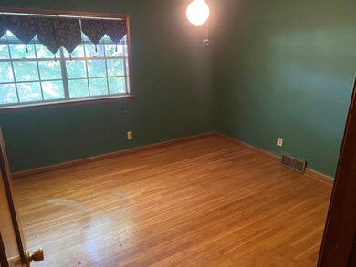 Empty room featuring hardwood / wood-style floors
