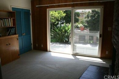 Dining area with fireplace and sliders to back