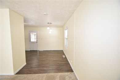 Living room into dining area/kitchen