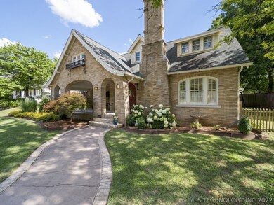 Winding sidewalk leads to an expansive, covered, t