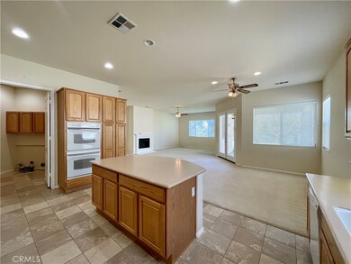 Kitchen opens onto dining area and living room. Lots of natural light throughout.