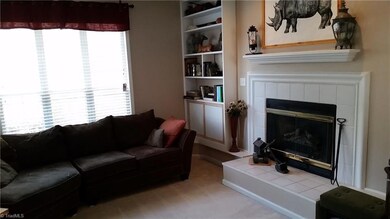 Sunken Living Room with gas logs & built in shelves