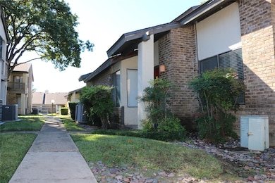 View of property exterior featuring a yard and coo