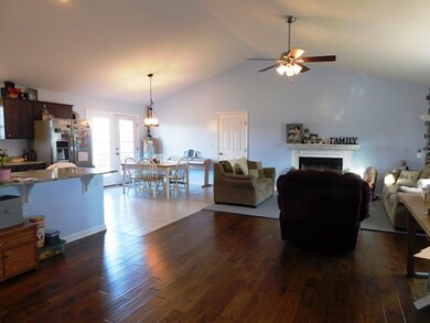 open foyer/living/dining/kitchen