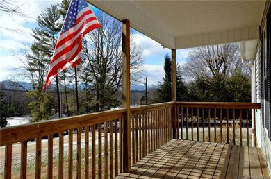 Covered front porch with distant mountain views