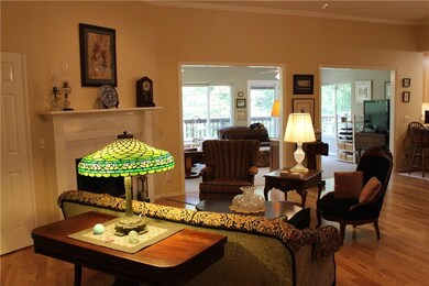 Living room opens to a heated and cooled Sunroom.