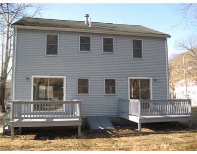 Exterior Back. Each unit has its own deck. The bul