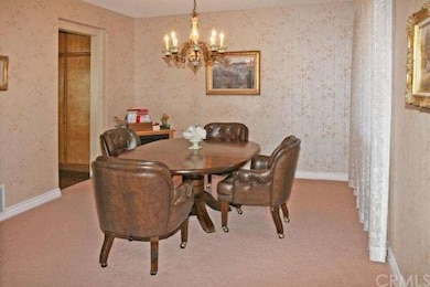 Formal dining room with door to kitchen 